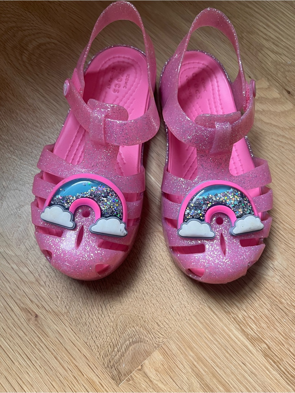CROCS Kids Pink Glitter Jelly Sandals with Rainbow and Cloud Charms